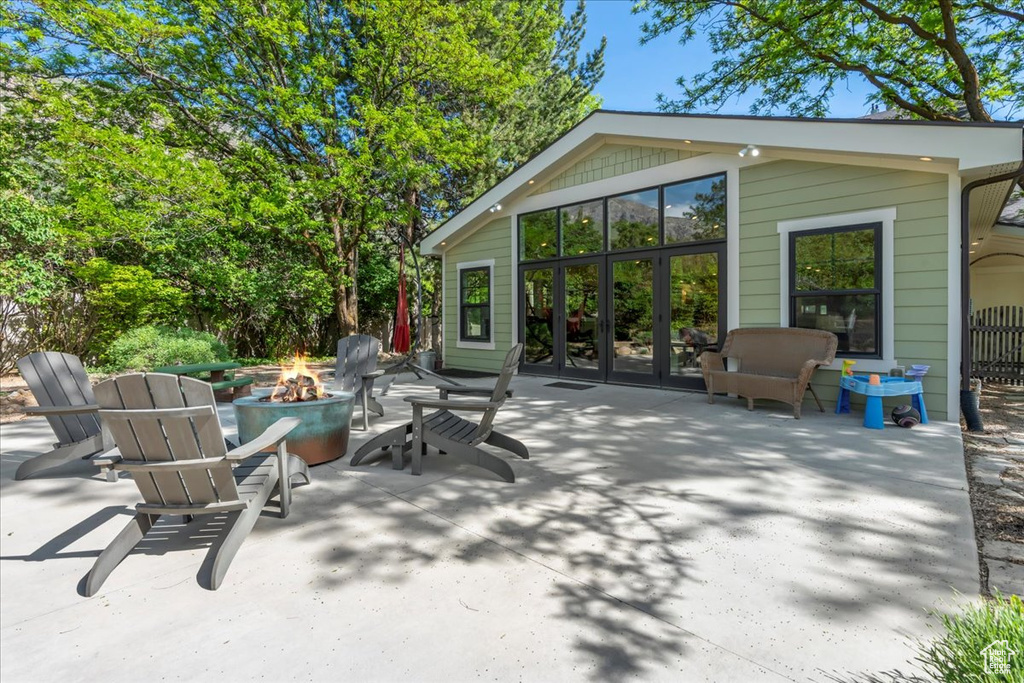 View of patio / terrace with an outdoor fire pit and french doors