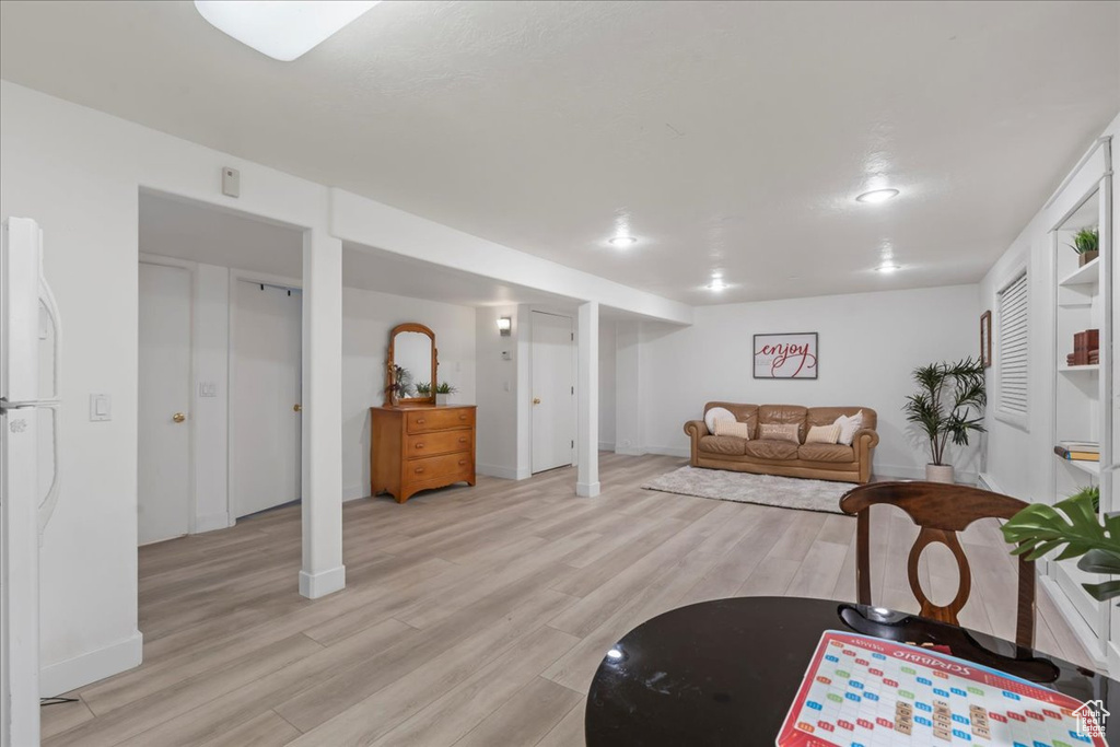 Living area featuring light wood finished floors and baseboards