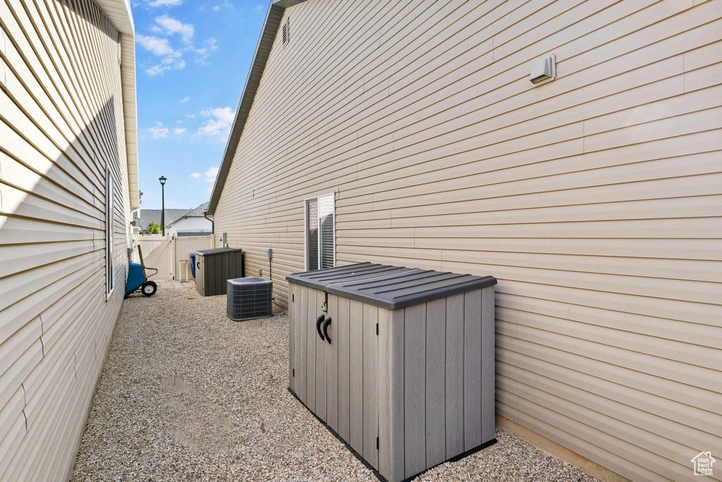 View of side of property with central AC
