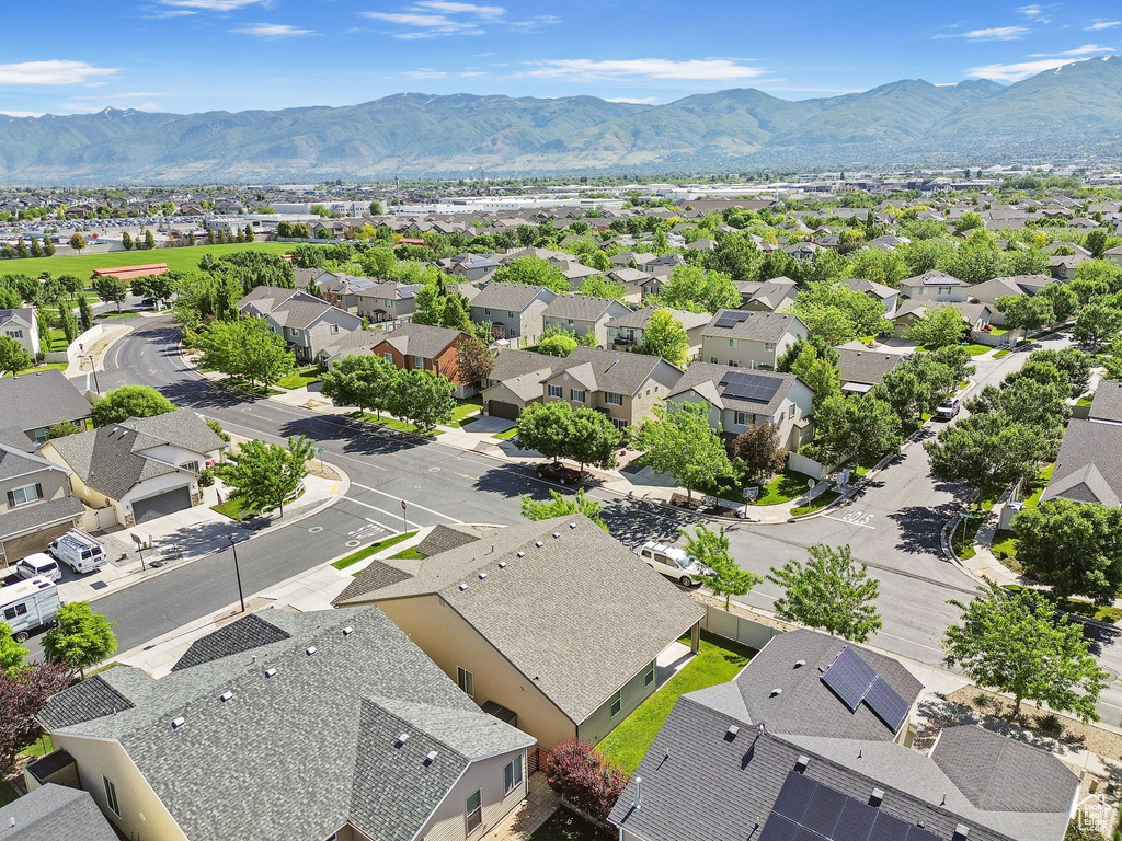 Aerial perspective of suburban area with a mountainous background