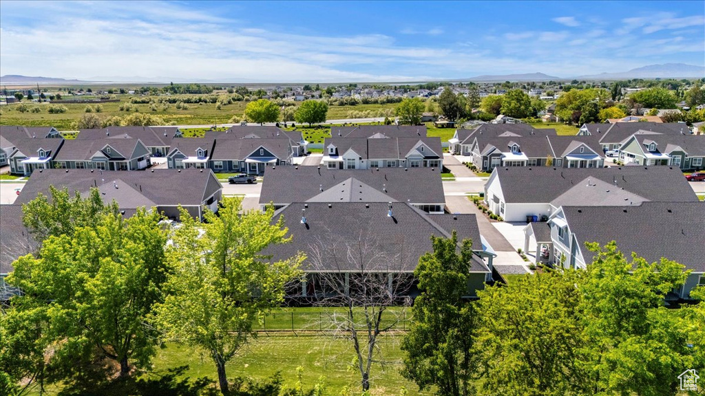 Aerial perspective of suburban area with a mountain backdrop
