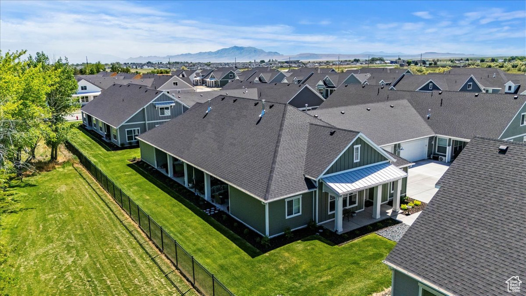 Aerial view of residential area featuring a mountainous background