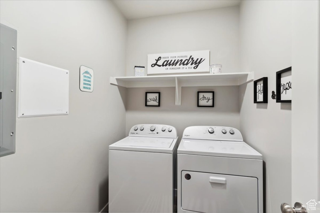Laundry room with washer and clothes dryer
