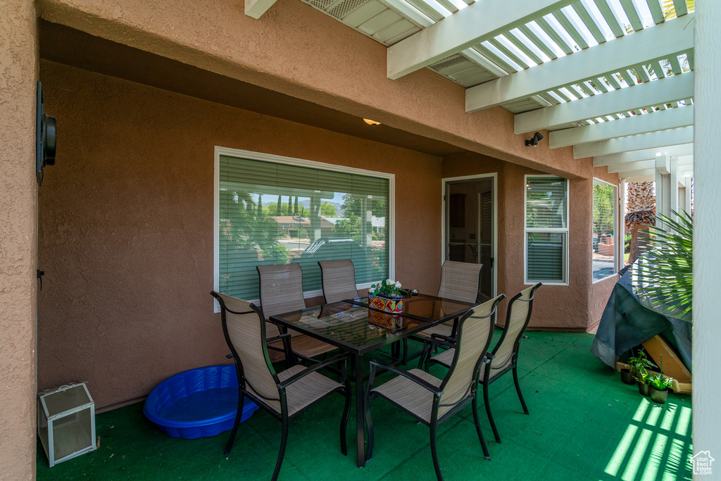 View of patio / terrace with a pergola and outdoor dining area