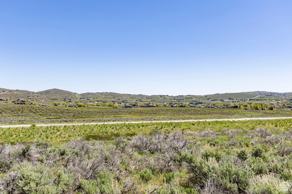 View of mountain background featuring rural landscape