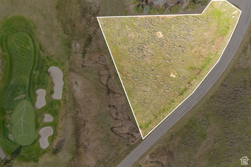 View of property location with property parcel outlined and a golf course