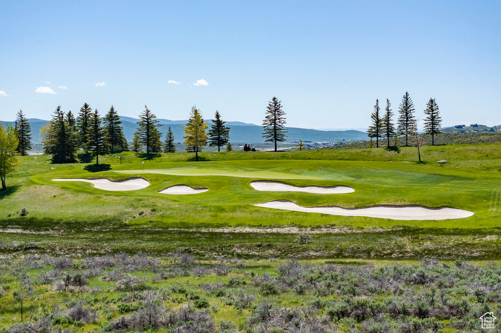 Surrounding community featuring a mountain view and view of golf course
