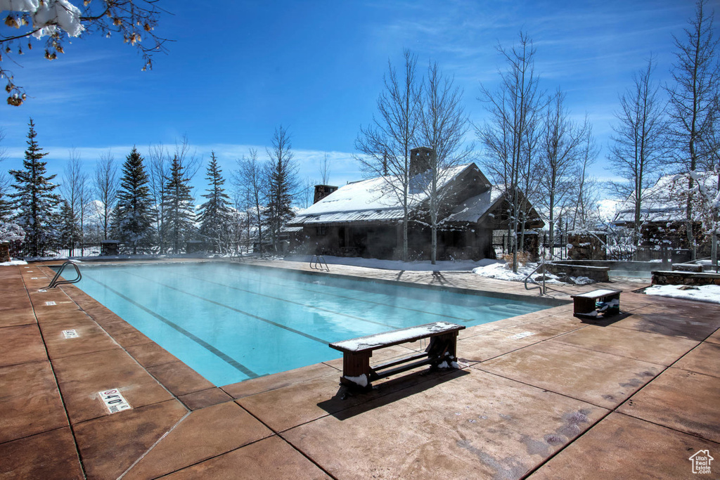 Community pool featuring a patio