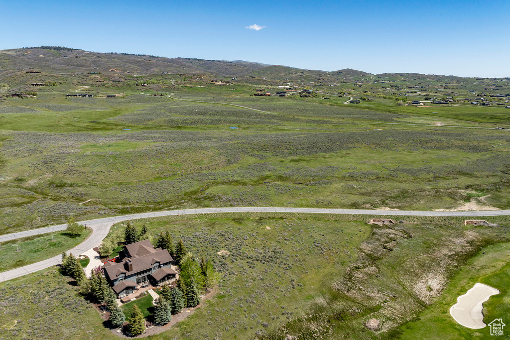 Aerial view of property's location featuring mountains and rural landscape