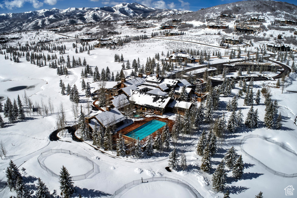 Snowy aerial view featuring a mountain view