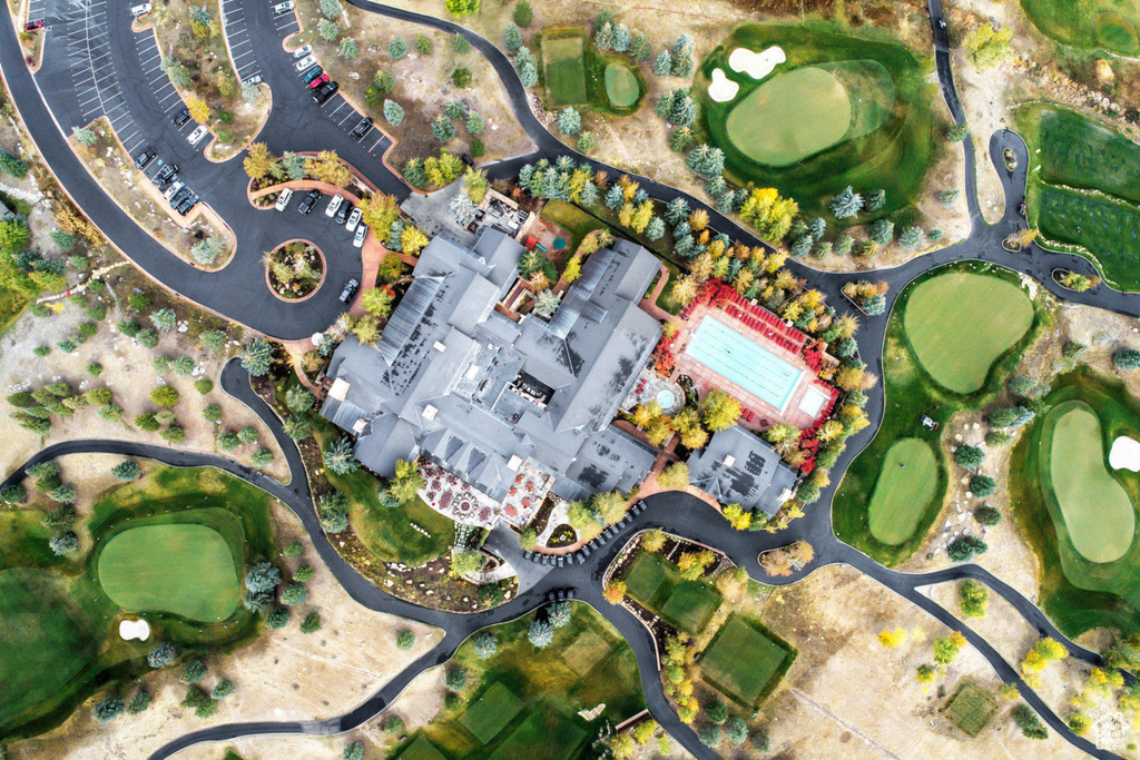 Aerial overview of property's location with a local golf course