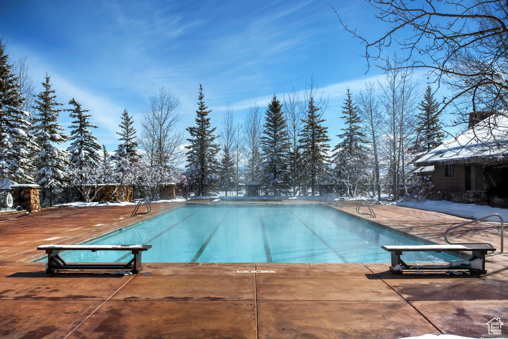 Outdoor pool with a patio