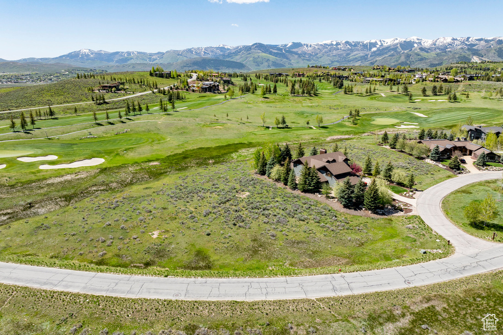 Bird's eye view of a mountainous background and a golf club