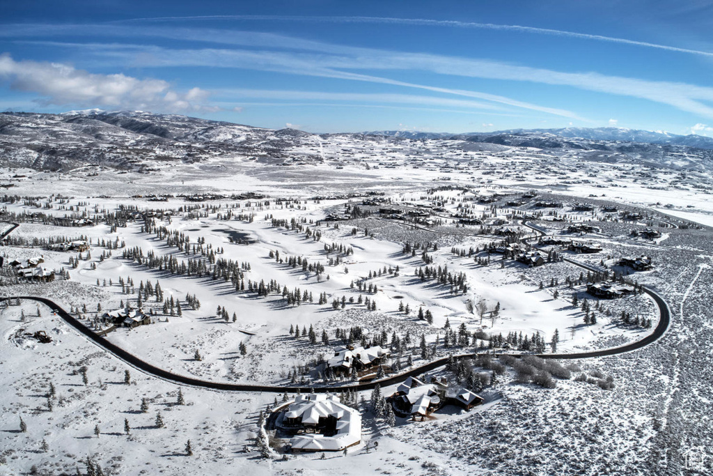 Snowy aerial view featuring a mountain view