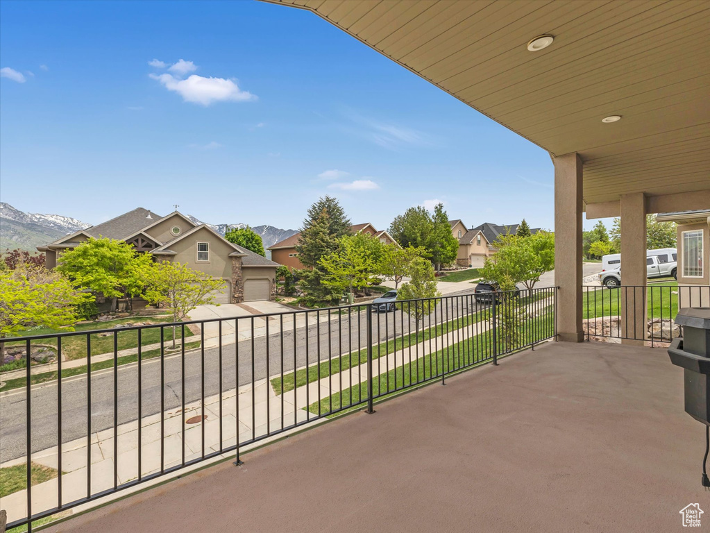 View of patio with a residential view and a mountain view
