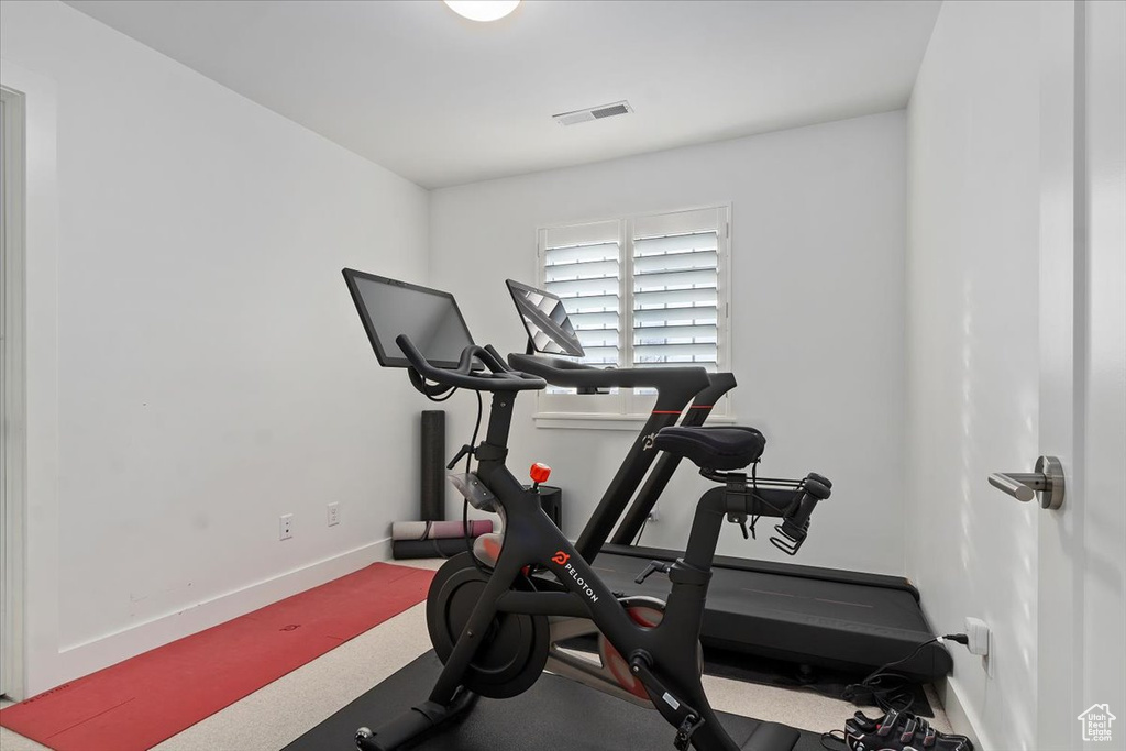 Workout area featuring baseboards