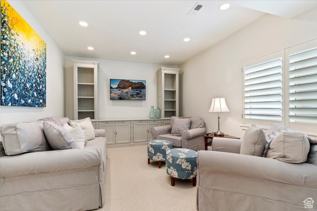 Living room with recessed lighting and carpet flooring