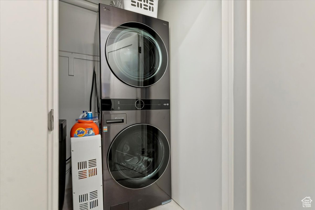 Laundry room featuring stacked washer / dryer