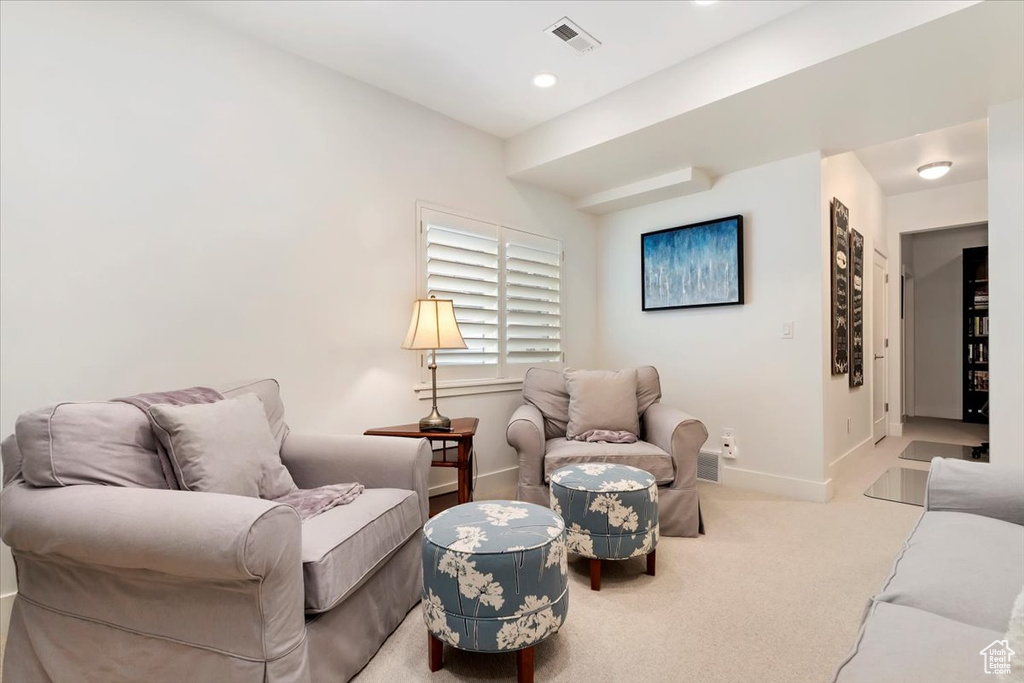 Living area featuring baseboards, carpet floors, and recessed lighting