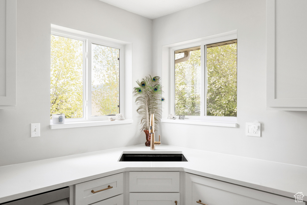 Kitchen with plenty of natural light and light countertops