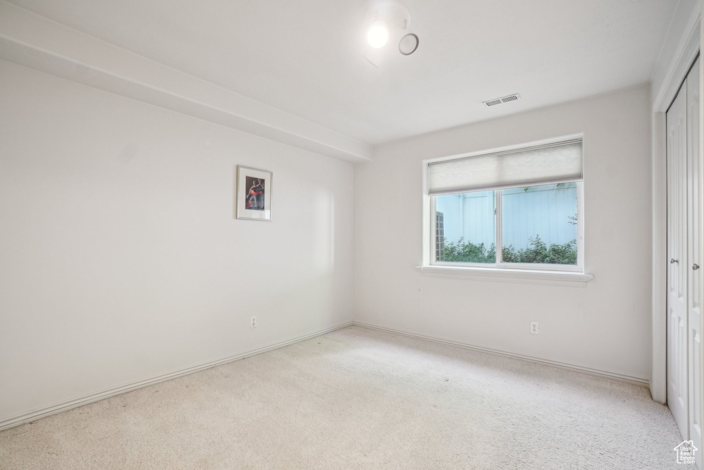 Unfurnished room featuring carpet flooring and baseboards