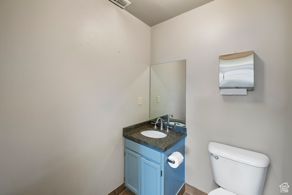 Half bath with toilet and vanity