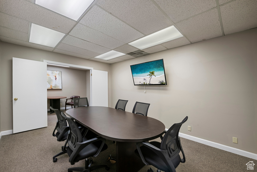 Home office with carpet, baseboards, and a paneled ceiling
