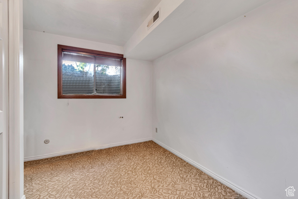 Unfurnished room with baseboards