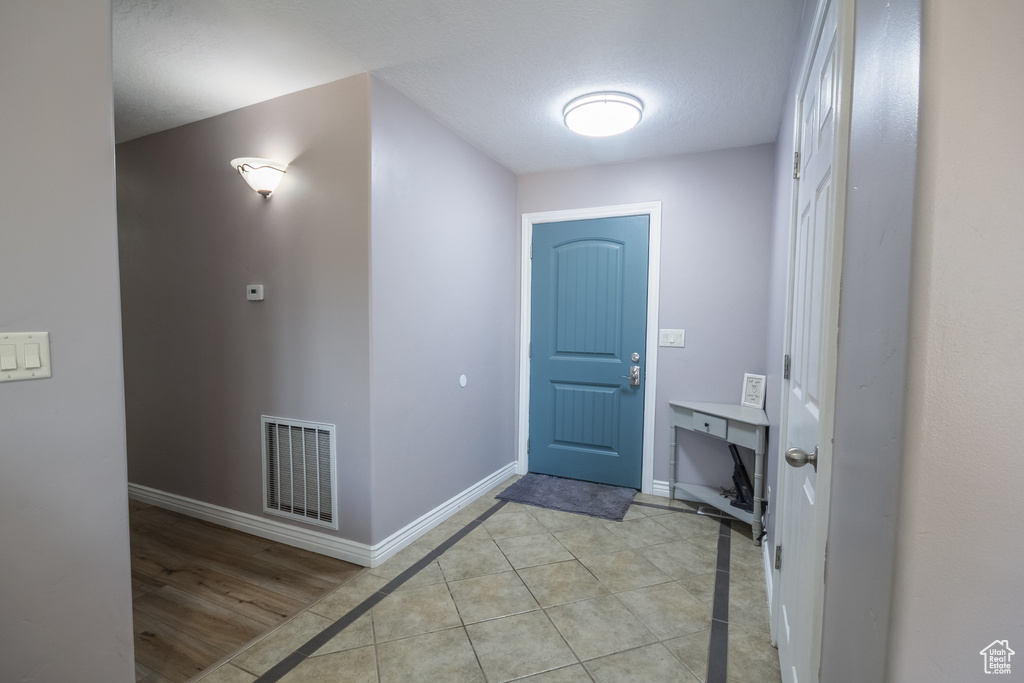 Entrance foyer featuring baseboards