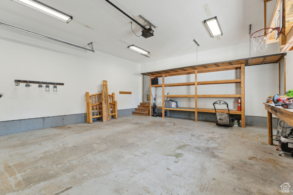 Garage featuring a garage door opener