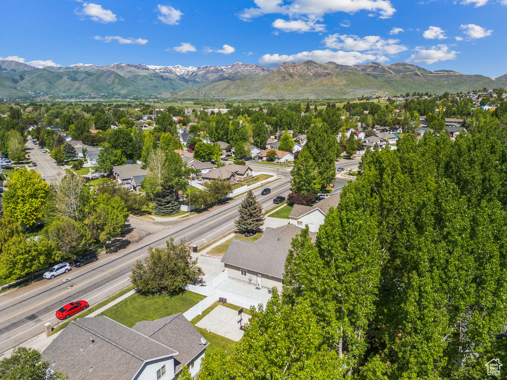 Aerial view of residential area featuring a mountainous background