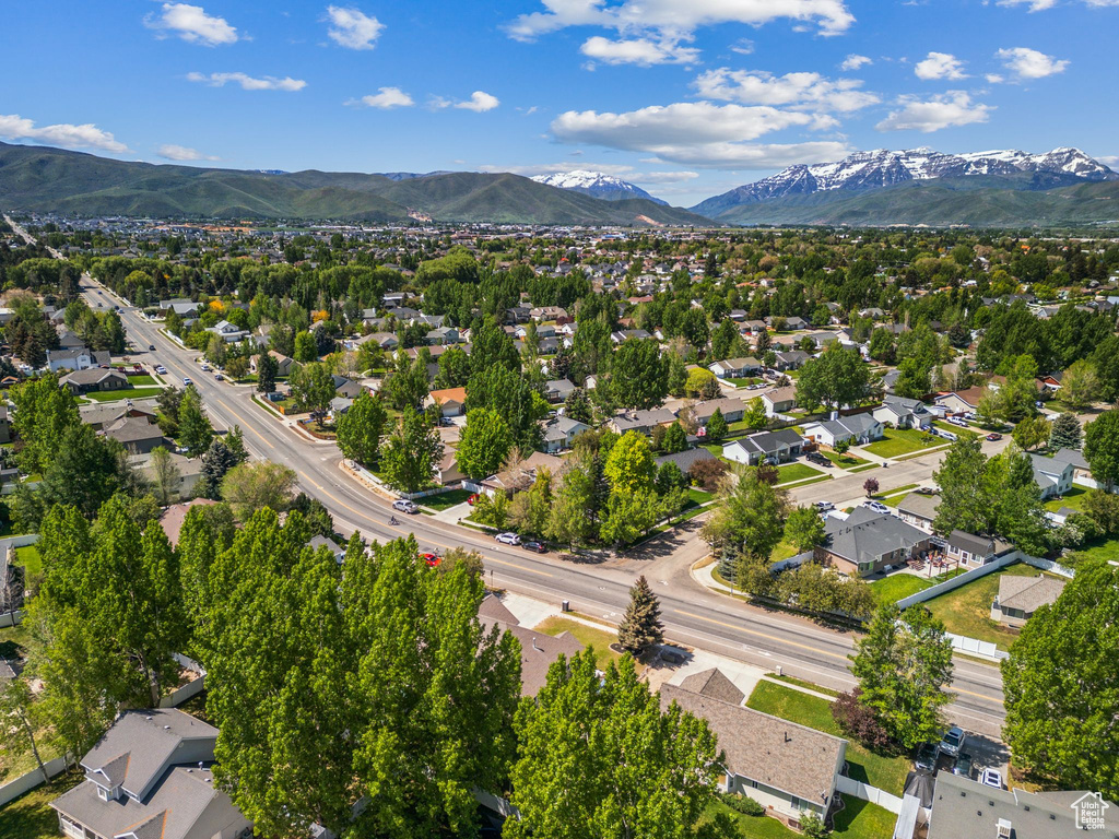 Aerial perspective of suburban area featuring a mountain backdrop