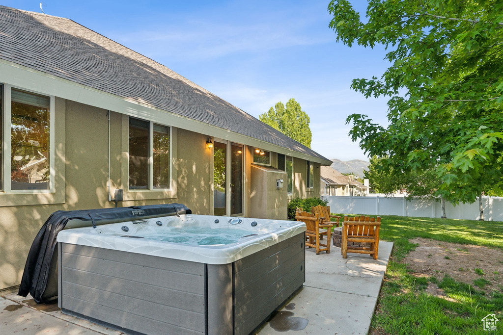 View of patio featuring a hot tub