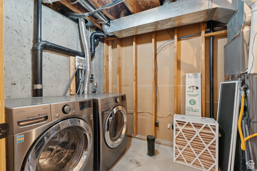Laundry area featuring separate washer and dryer