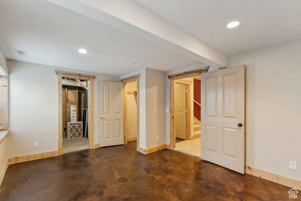 Unfurnished bedroom with baseboards, recessed lighting, and finished concrete floors