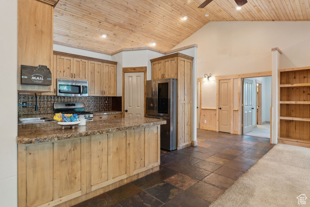 Kitchen featuring stainless steel appliances, wood ceiling, backsplash, a peninsula, and ceiling fan