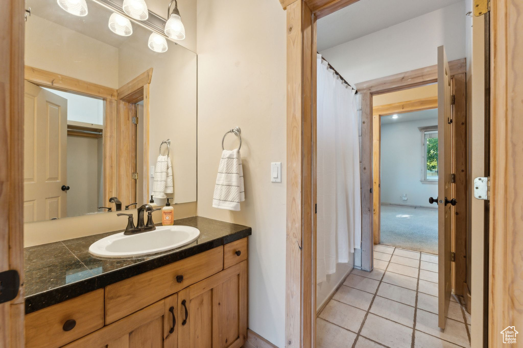 Bathroom with vanity and tile patterned floors