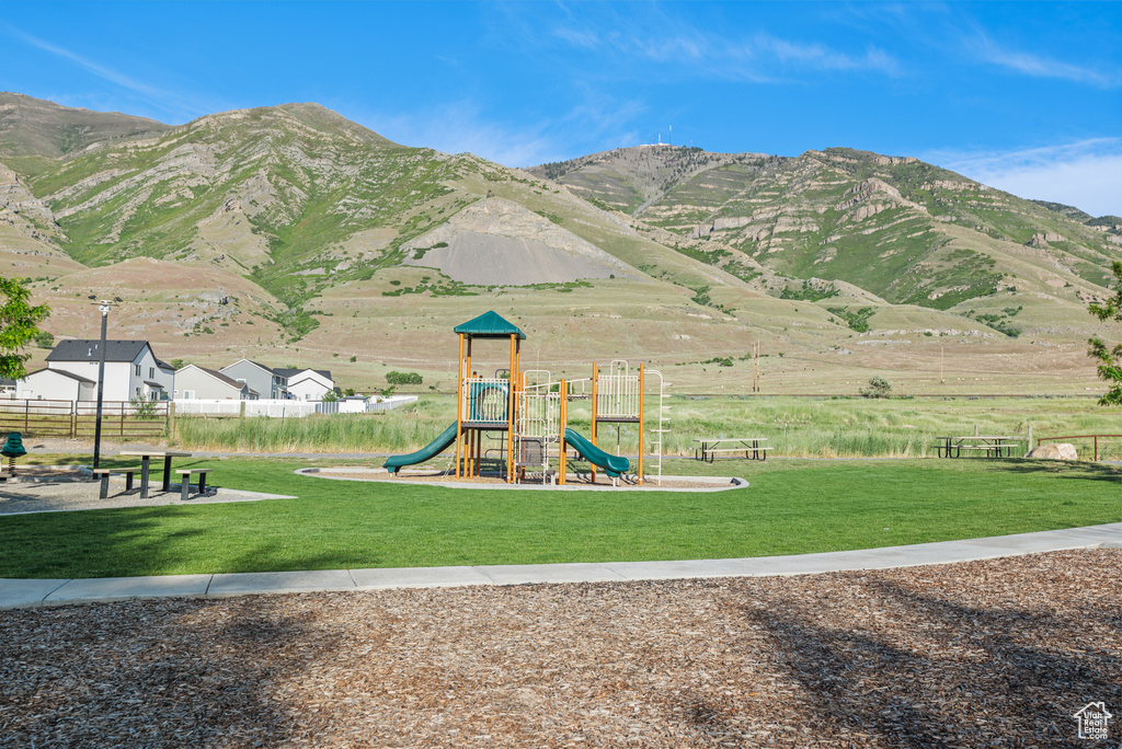 Community playground featuring a mountain view