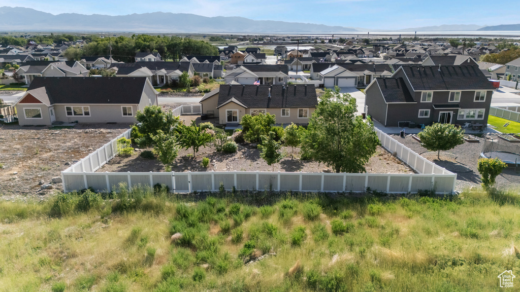Aerial view of residential area featuring a mountain backdrop