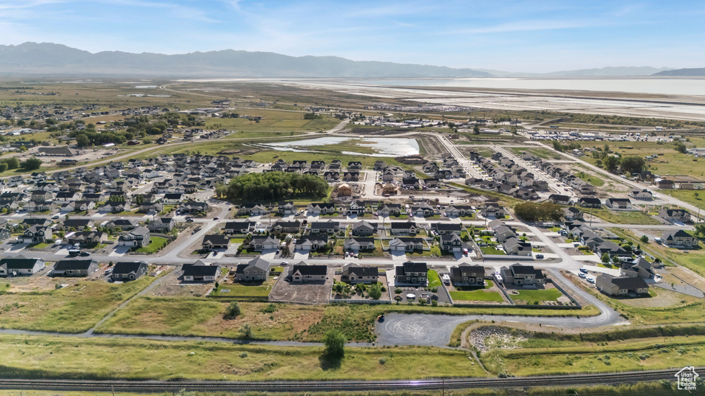 Aerial view of property\'s location with a water and mountain view