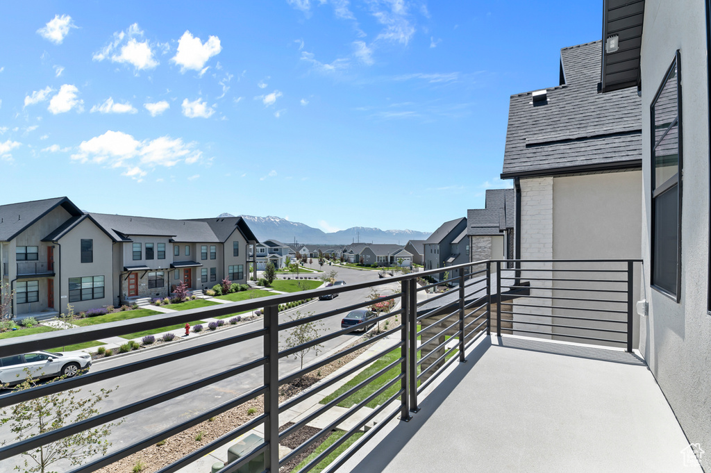 Balcony with a residential view and a mountain view