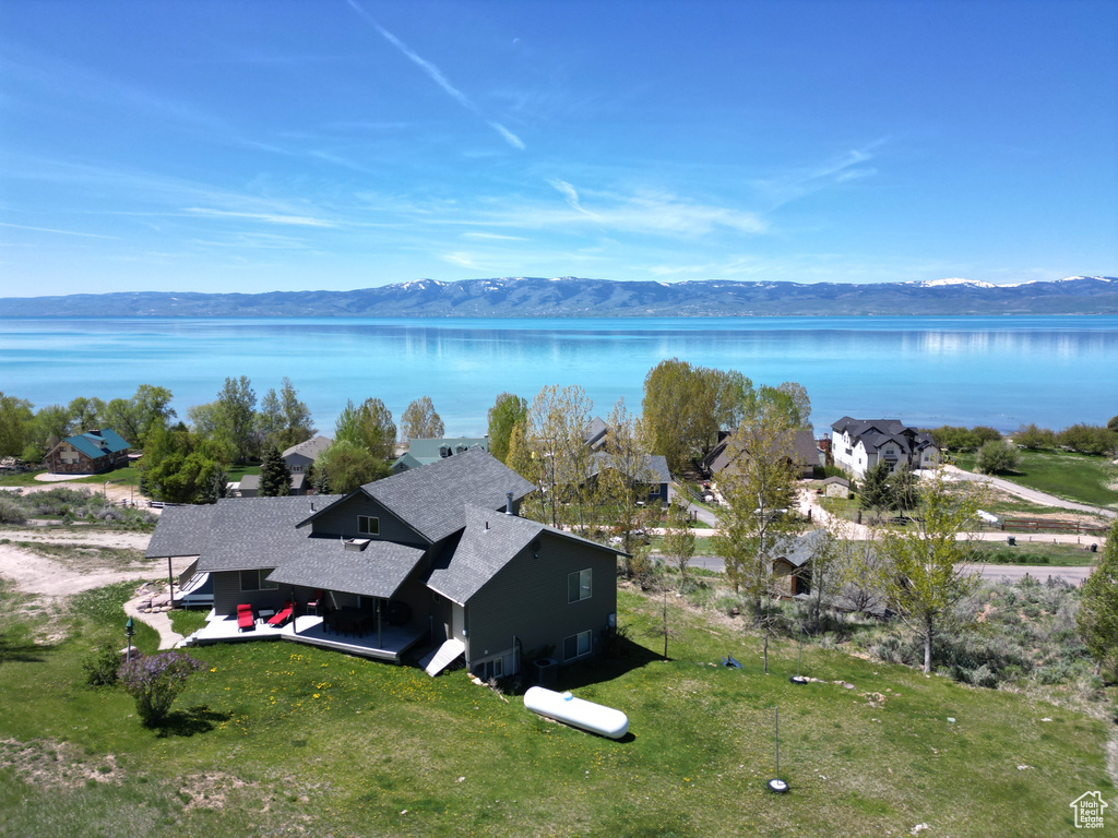 View from above of property with a water and mountain view