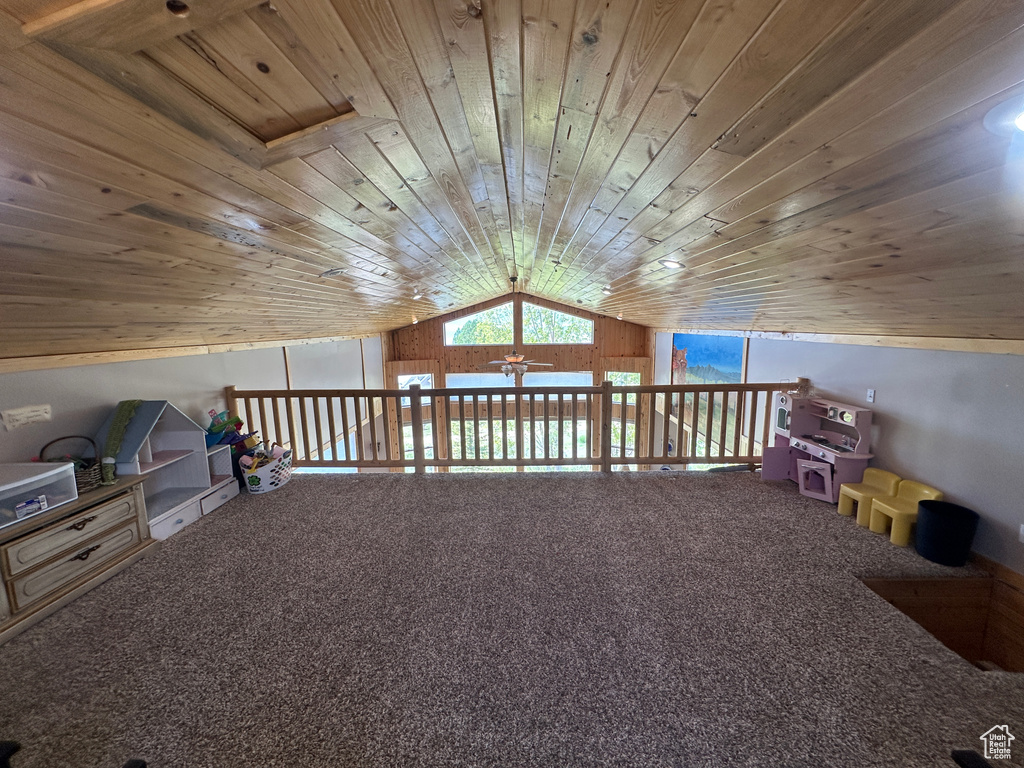 Bonus room featuring vaulted ceiling, wooden ceiling, carpet, and a ceiling fan