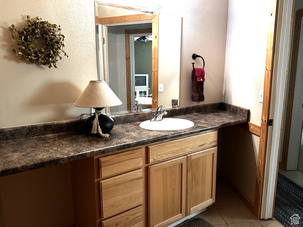 Bathroom featuring vanity and tile patterned floors