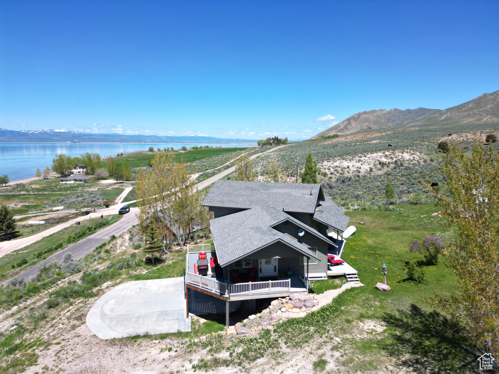 View of subject property featuring a water and mountain view