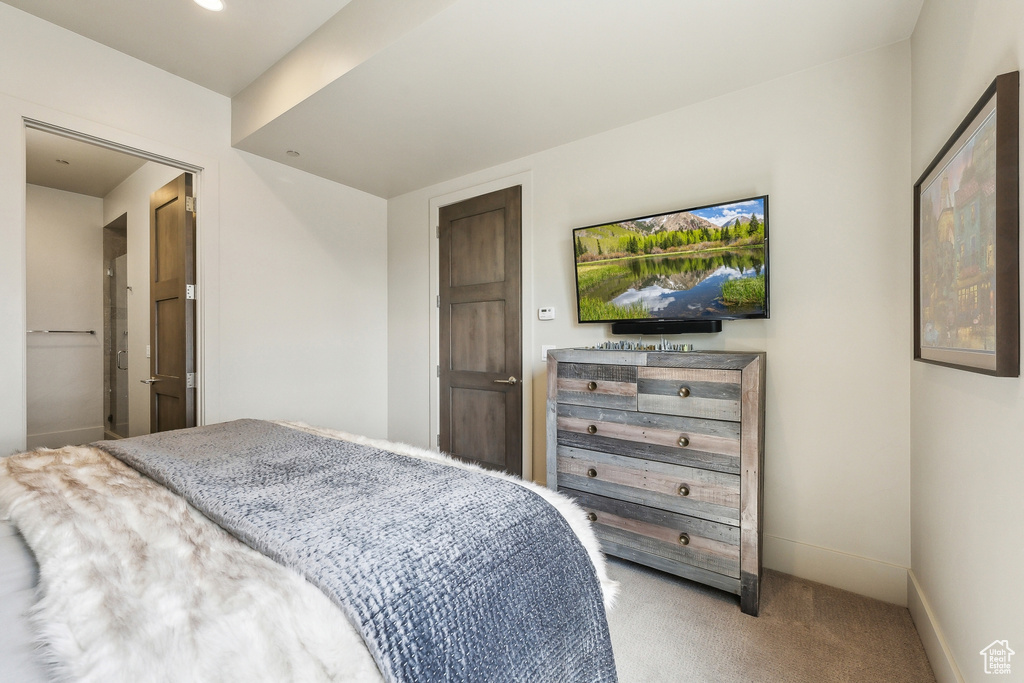Bedroom with baseboards and carpet floors