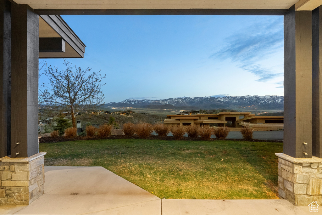 View of yard featuring a patio and a mountain view