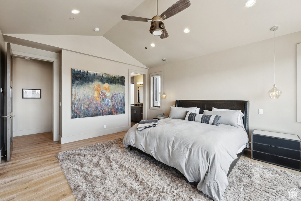 Bedroom featuring light wood finished floors, lofted ceiling, and recessed lighting
