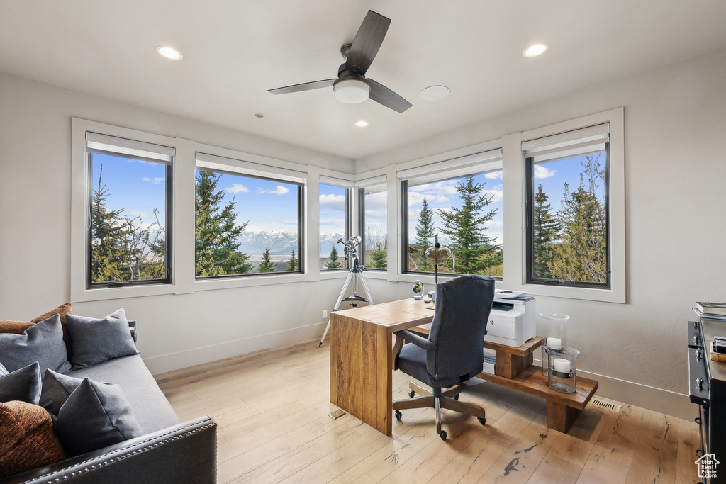 Home office with light wood finished floors, baseboards, a ceiling fan, and recessed lighting