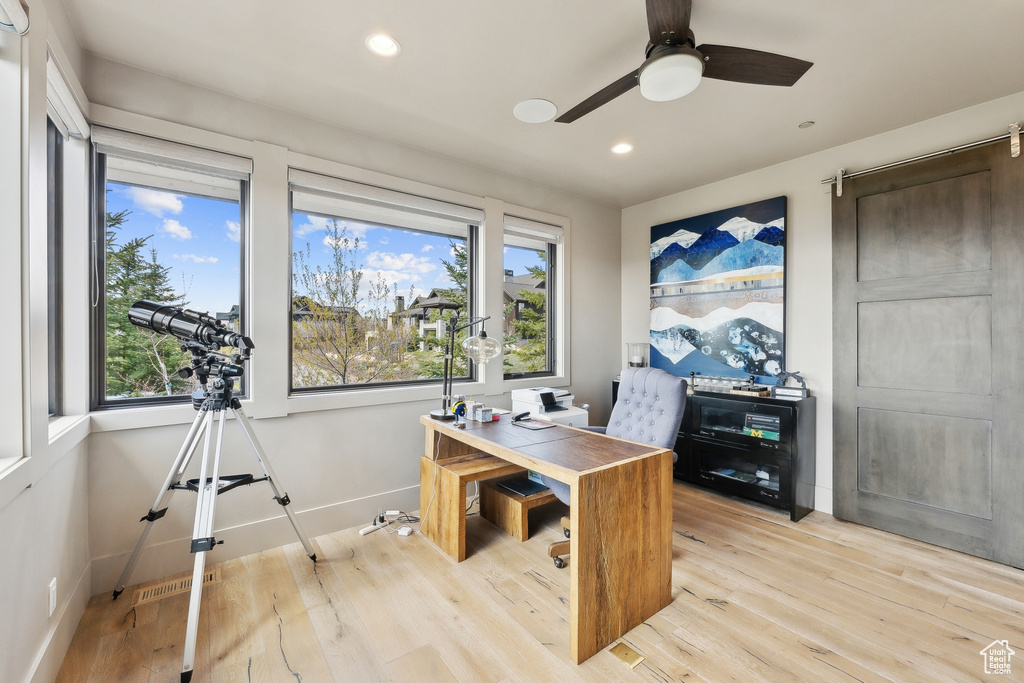Home office featuring visible vents, baseboards, ceiling fan, light wood-style floors, and recessed lighting